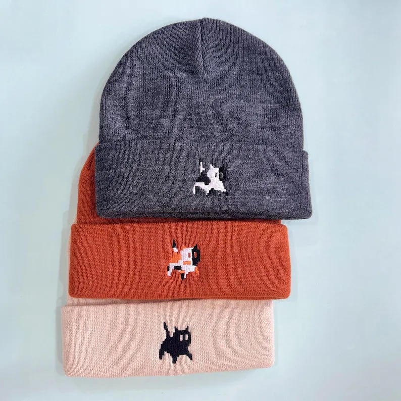 Custom beanies by Pinlord.com featuring unique designs and cozy knit fabric, perfect for stylish winter headwear.