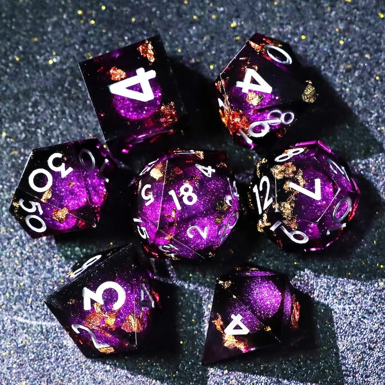Custom metal dice set from Pinlord.com featuring engraved numbers and a polished finish for tabletop gaming.