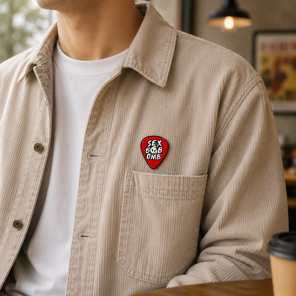 Close-up of the "Boom Goes the Rebel" enamel pin featuring a colorful, detailed design with a bomb illustration.