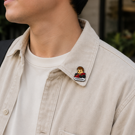 Scarlet Prince Charles Leclerc enamel pin featuring a detailed design of the Formula 1 driver for racing fans.