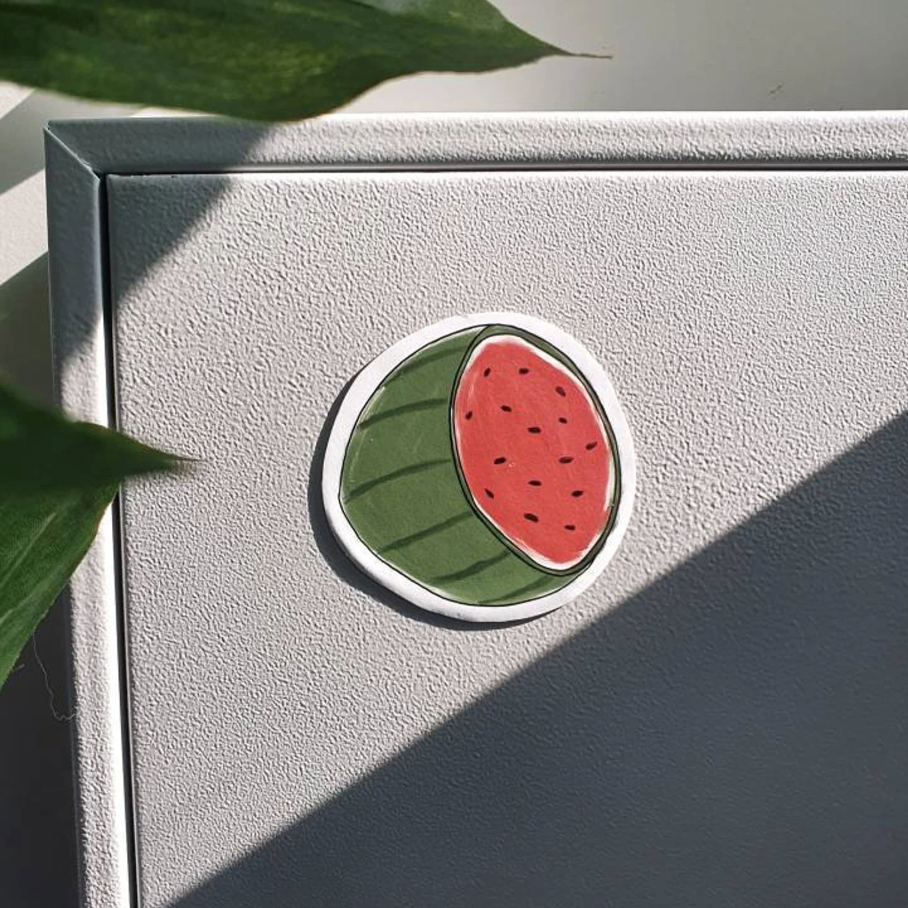 Custom magnets by Pinlord.com featuring unique designs, shown in various shapes and sizes for personalized decoration.