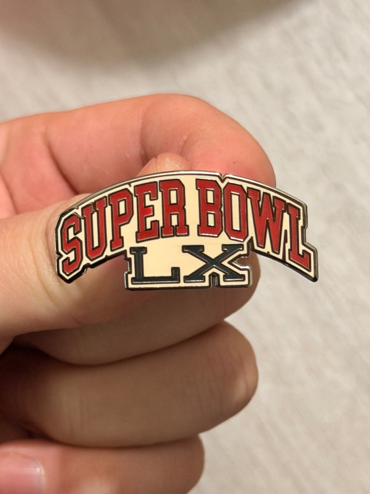 Abercrombie & Fitch Super Bowl After-Party custom enamel pins displayed on a project board.