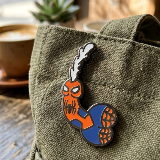 Close-up of a "Friendly Neighborhood" enamel pin featuring a spider design, perfect for adult accessory collections.