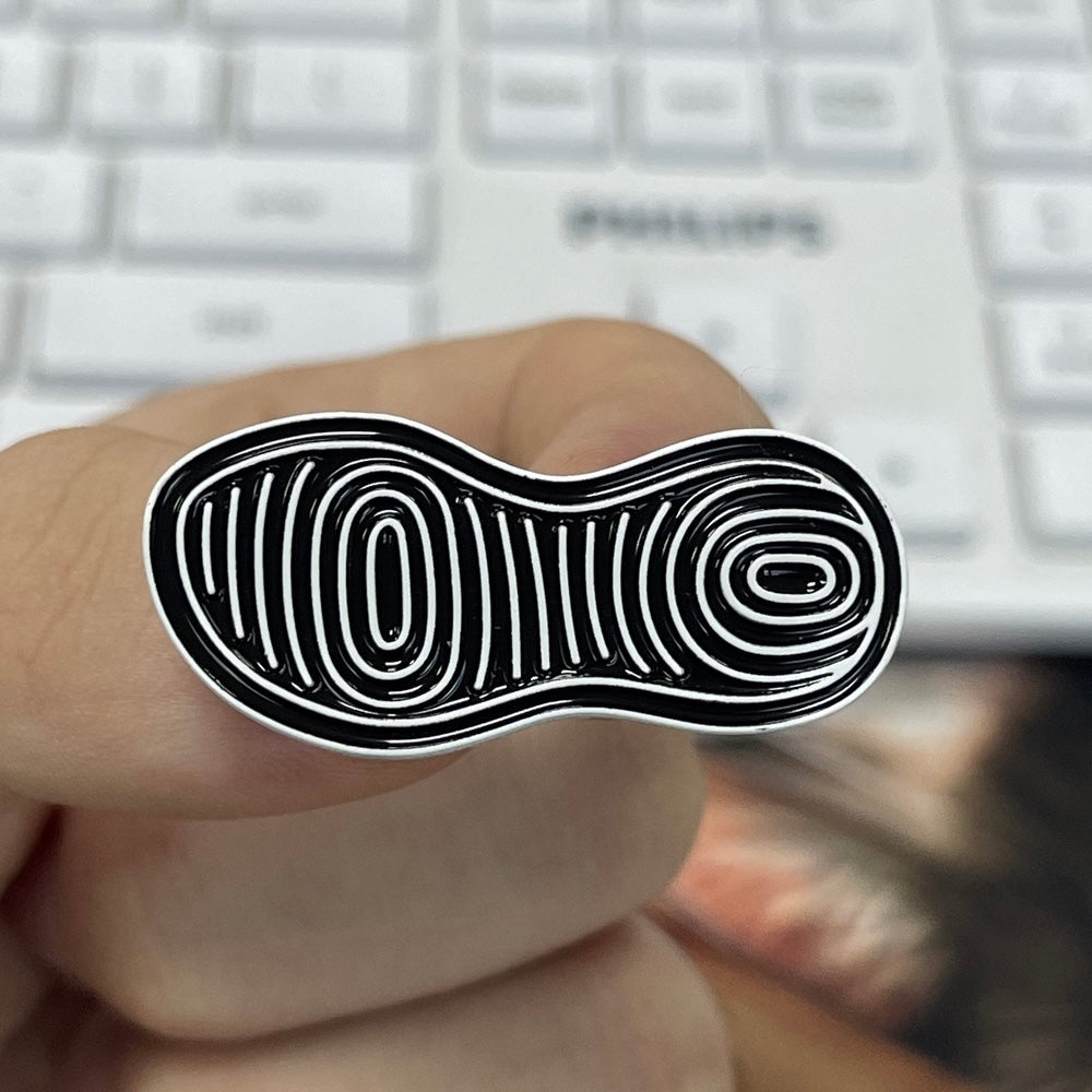 Allbirds x Pinlord sustainable custom enamel pins and keychains featuring colorful, eco-friendly designs on a white background.
