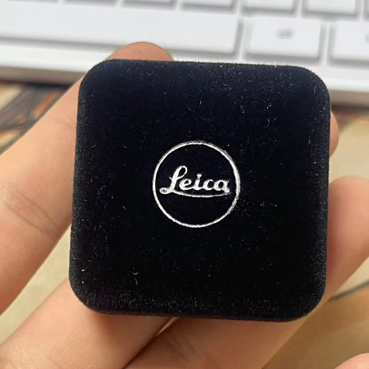 Leica x Pinlord custom enamel pin featuring intricate design and luxury presentation, showcasing detailed craftsmanship and vibrant colors.
