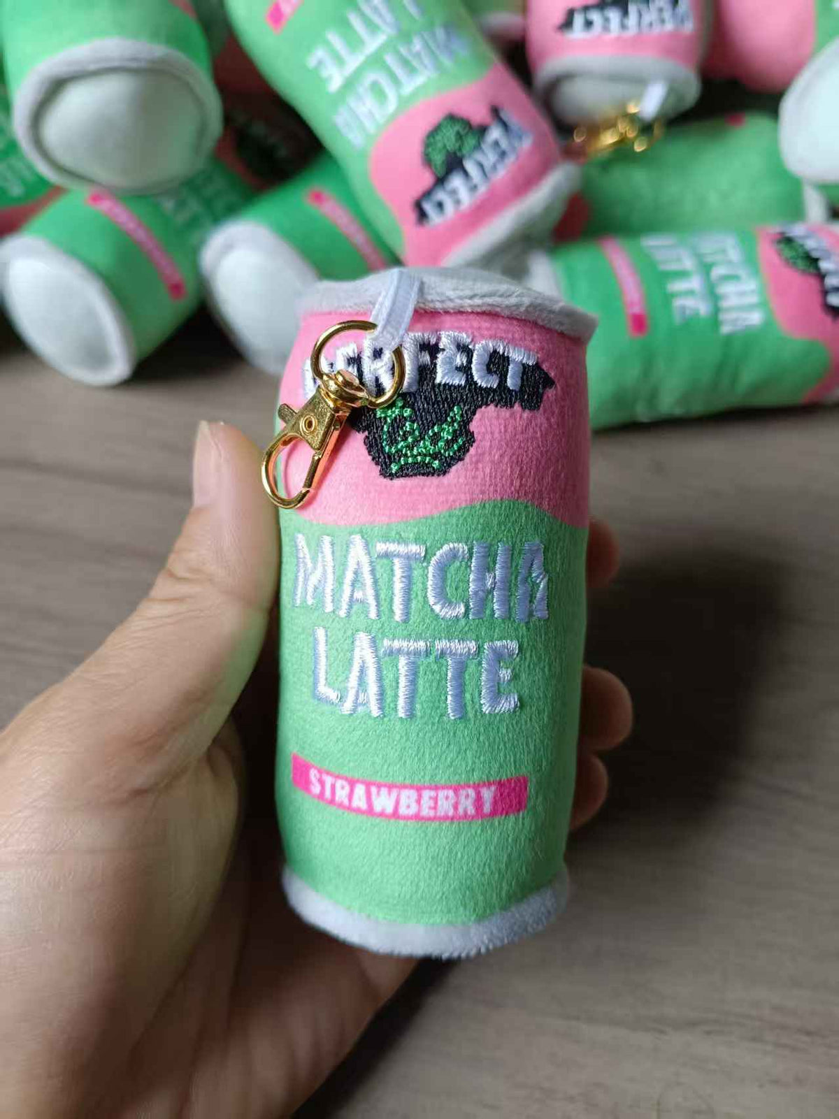 Colorful PerfectTed x Pinlord plush keychain featuring a playful matcha-themed design, soft fabric, and cute character details.