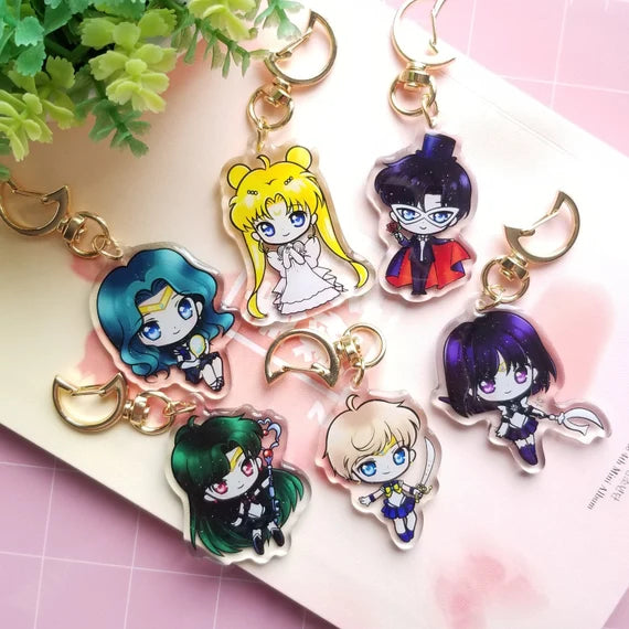 Custom acrylic charms featuring colorful, themed designs, perfect for accessories and crafts, by Pinlord.com.