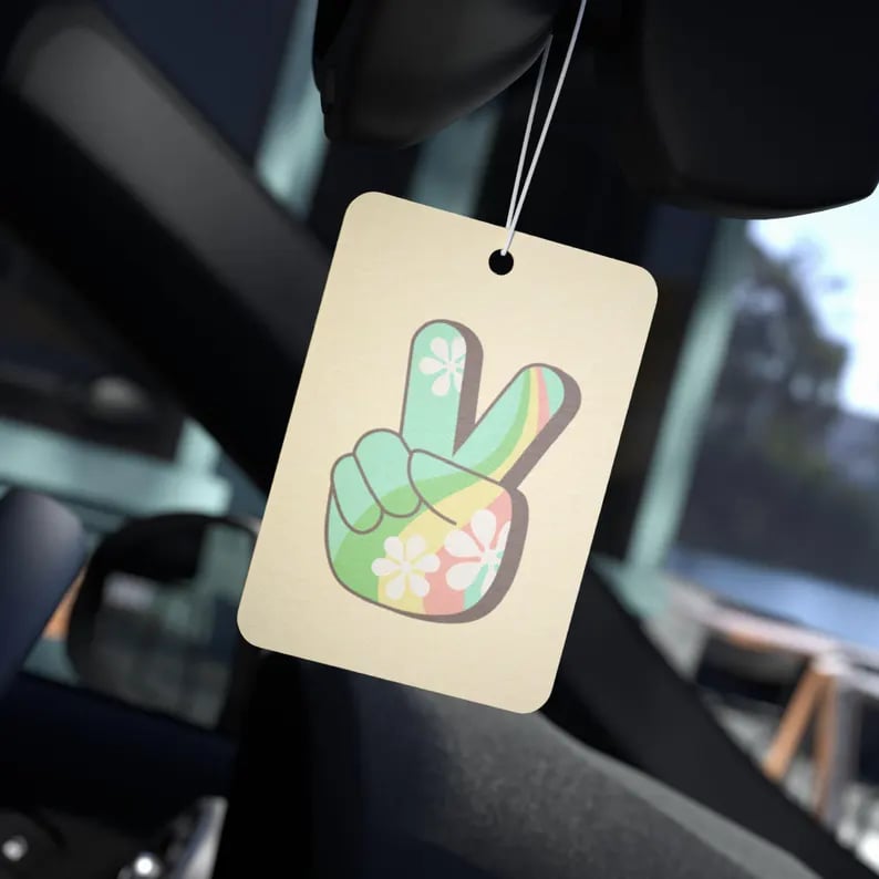 Custom air freshener featuring vibrant design, made by Pinlord.com, designed to enhance vehicle or room scent.