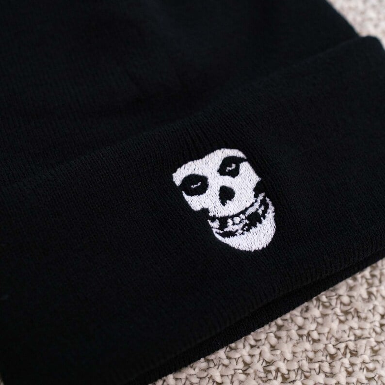Custom beanies by Pinlord.com featuring colorful designs and cozy knit fabric, perfect for warm winter headwear.