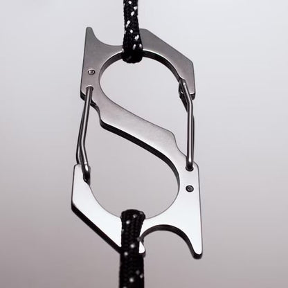 Custom Pinlord.com carabiner with engraved design, made of durable metal, featuring a spring-loaded gate for secure attachment.