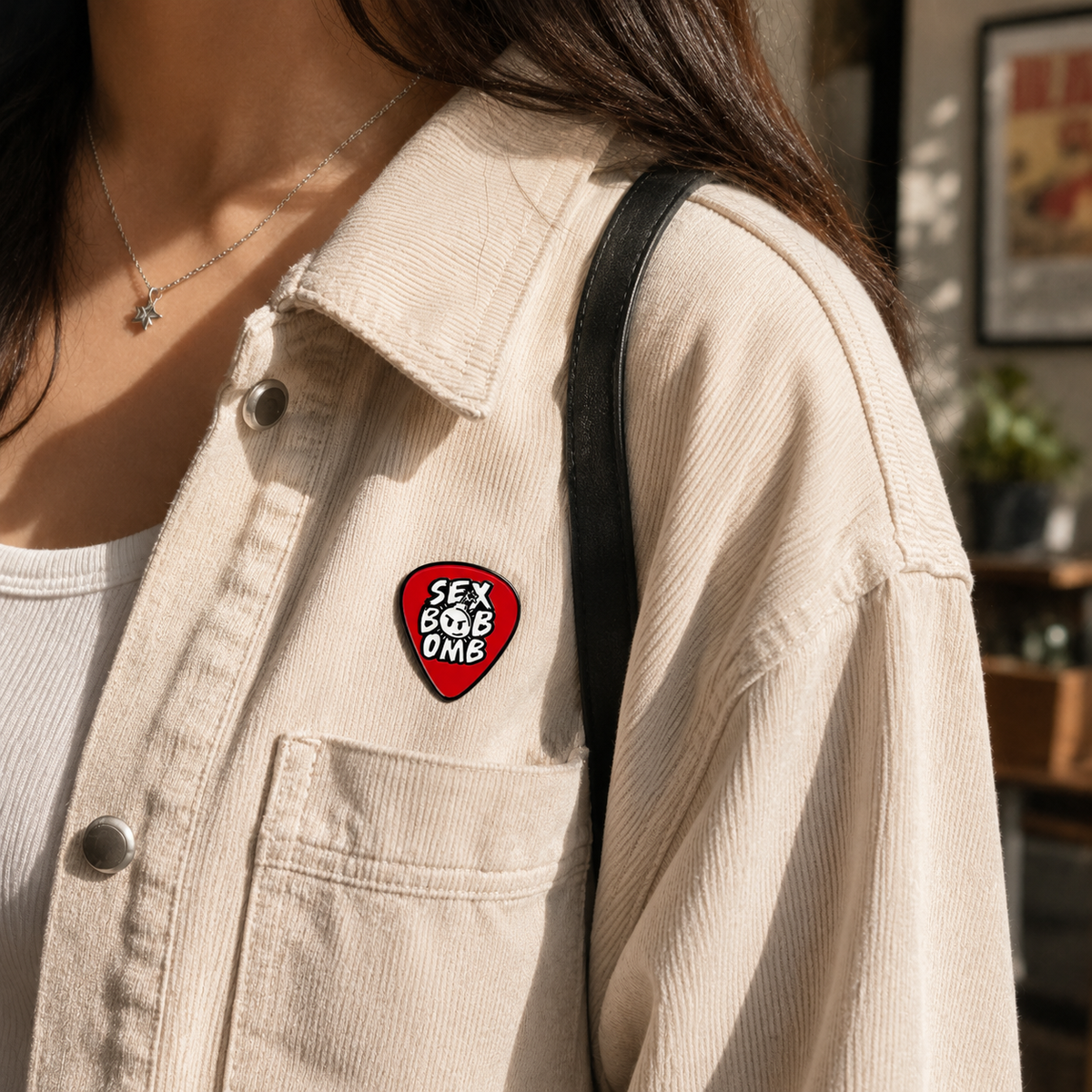 Enamel pin featuring a bold "Boom Goes the Rebel" design with a bomb illustration, crafted by Pinlord.com.