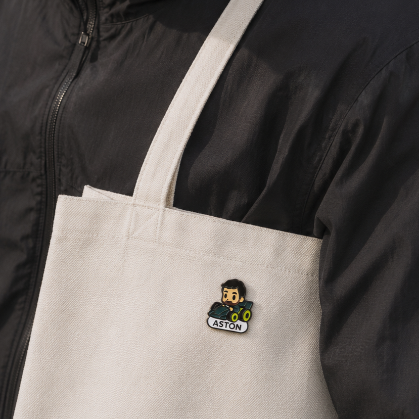 Evergreen Fernando Alonso enamel pin featuring a detailed design of the racing driver on a metal pin back.