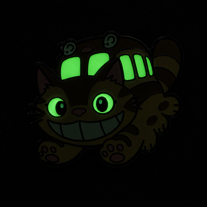 Enamel pin featuring a grinning Catbus companion, with detailed design and vibrant colors, perfect for anime and collectible pin fans.