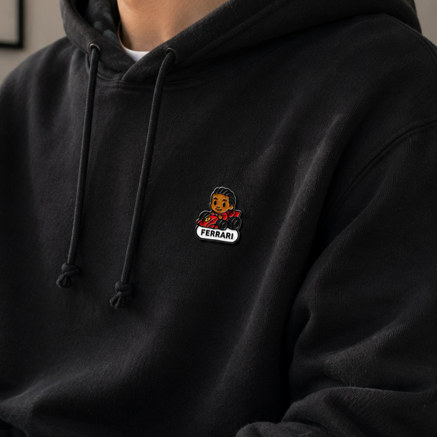 Enamel pin featuring Lewis Hamilton's portrait, detailed design showcasing his iconic racing helmet, by Pinlord.com.