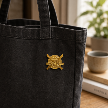 24k gold "Three-Blade Legend" logo enamel pin featuring a detailed design with three blades, shiny gold finish, and pin backing.
