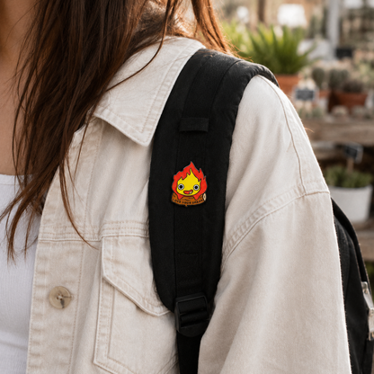 Calcifer enamel pin from Love my Spark collection, featuring a fiery design on a detailed metal pin.