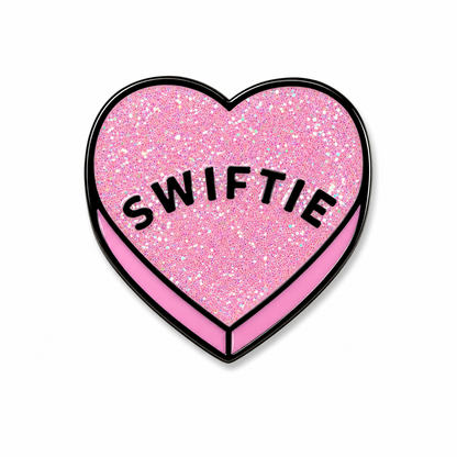 Close-up of a colorful Swiftie enamel pin featuring a heart design, made by Pinlord.com, perfect for decorating bags or jackets.