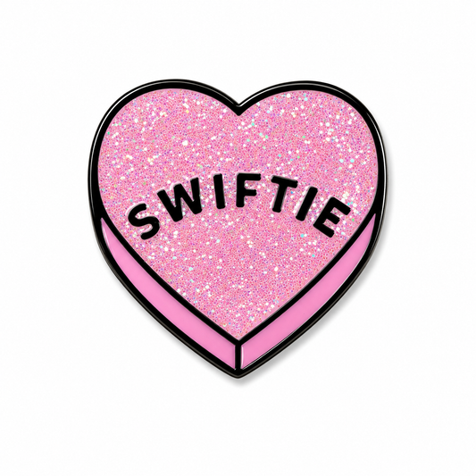 Close-up of a colorful Swiftie enamel pin featuring a heart design, made by Pinlord.com, perfect for decorating bags or jackets.