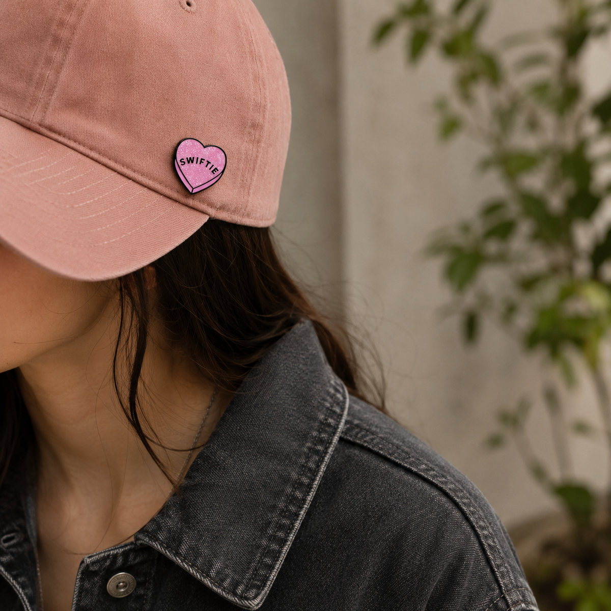 Colorful "Swiftie" enamel pin featuring a heart design, perfect for fans, made by Pinlord.com, displayed on a white background.