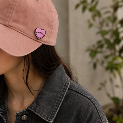 Colorful "Swiftie" enamel pin featuring a heart design, perfect for fans, made by Pinlord.com, displayed on a white background.