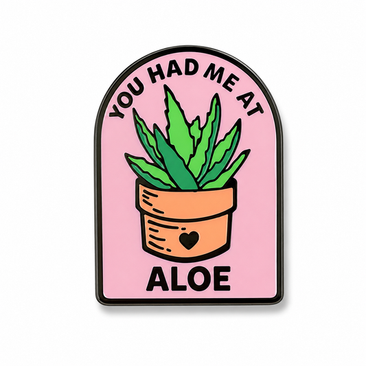 Aloe plant enamel pin featuring the phrase "You Had Me at Aloe" with green leaves, designed by Pinlord.com.
