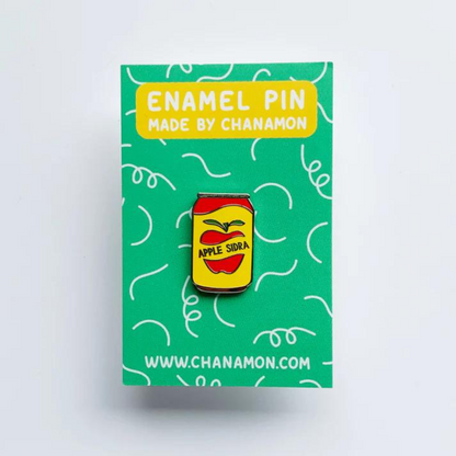 Custom enamel pins by Pinlord.com featuring colorful, detailed designs on a shiny metal surface.