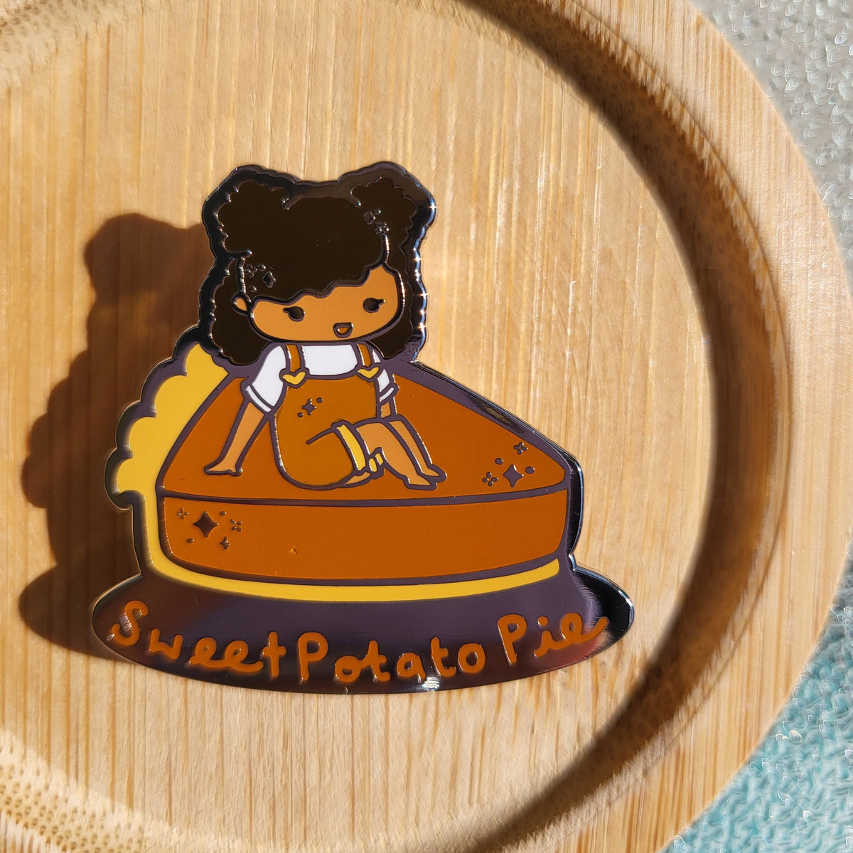 Custom enamel pins by Pinlord.com featuring colorful, detailed designs on a metal backing, perfect for accessories and collectibles.