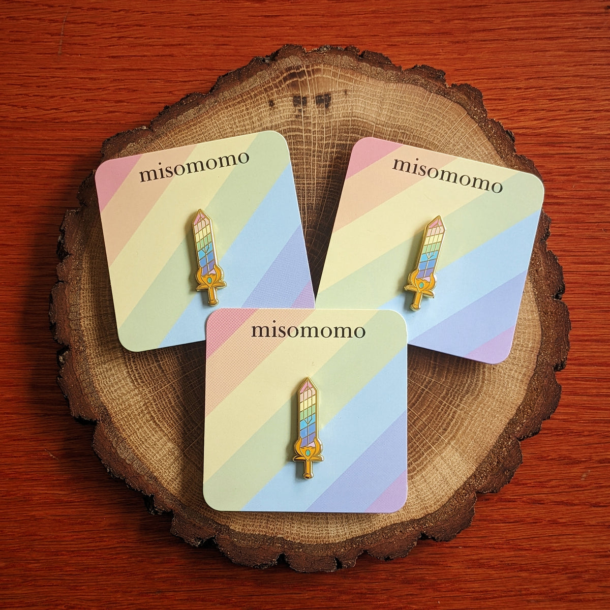 Custom enamel pins from Pinlord.com featuring colorful, detailed designs on metal with a polished finish.