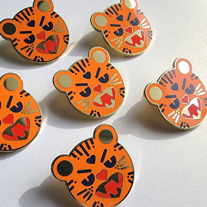 Custom enamel pins by Pinlord.com featuring colorful, detailed designs on high-quality metal pins.