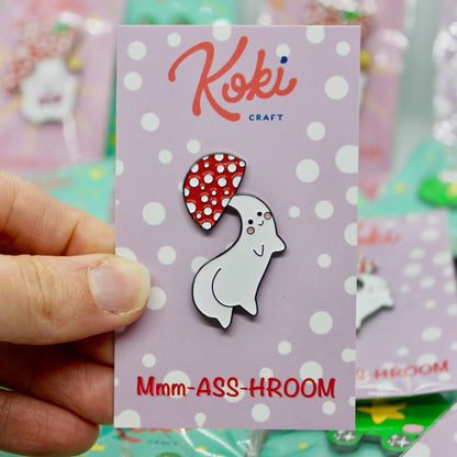 Custom enamel pins featuring unique designs from Pinlord.com, shown in a variety of colors and shapes.