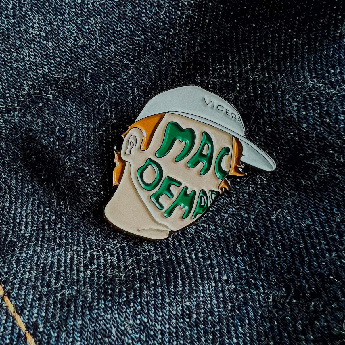 Custom enamel pins by Pinlord.com featuring colorful, detailed designs on a white background.