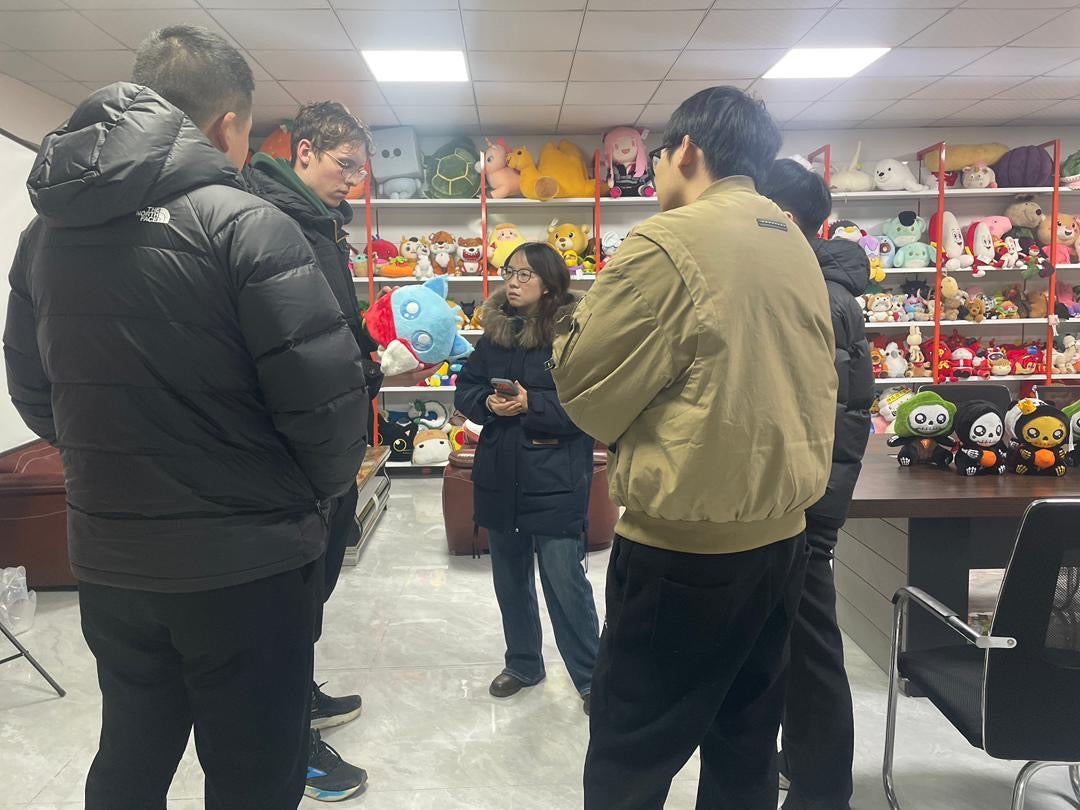 Private factory tour guided by Pinlord.com, showing factory interior with manufacturing equipment and production process.