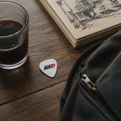 Fujiwara Tofu Shop Initial D guitar pick by Pinlord.com featuring a detailed design of a small tofu shop background.