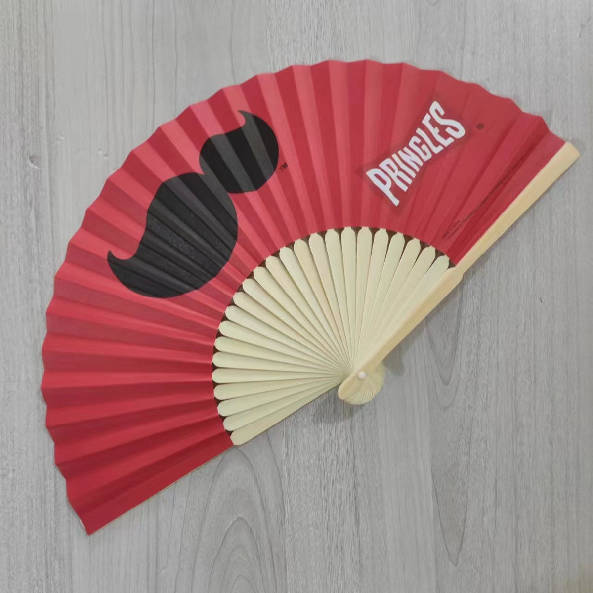 Custom hand fans with intricate designs, featuring vibrant colors and lightweight wooden frames by Pinlord.com.