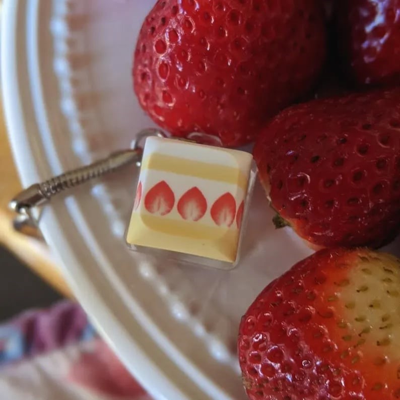 Custom keycap keychains featuring colorful, detailed keycap designs from Pinlord.com, perfect for key organizers and accessories.