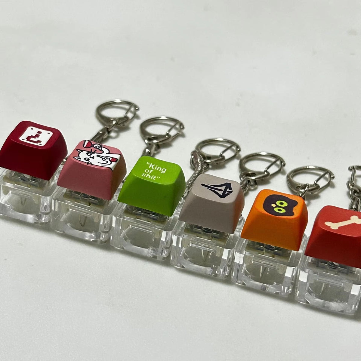 Custom keycap keychains featuring colorful, detailed designs from Pinlord.com, perfect for keyring accessories.