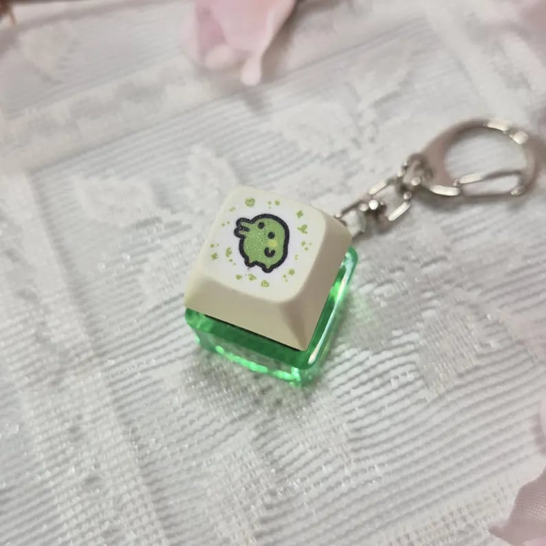Colorful custom keycap keychains with unique designs, featuring keycap shapes and vibrant details, ideal for key organization.