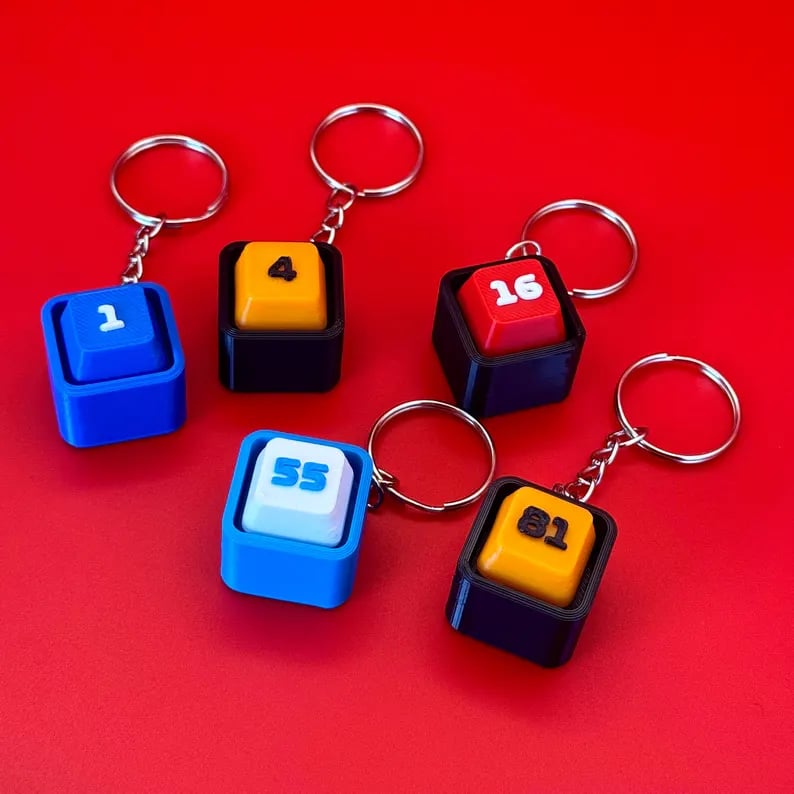 Colorful custom keycap keychains featuring unique designs, perfect for keychains and accessories.