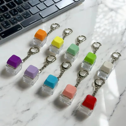 Custom keycap keychains featuring colorful, detailed designs, perfect for decorating keys and bags, by Pinlord.com.