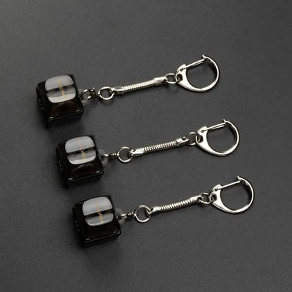 Custom keycap keychains featuring colorful, miniature keycaps with intricate designs, perfect for keyring accessories.
