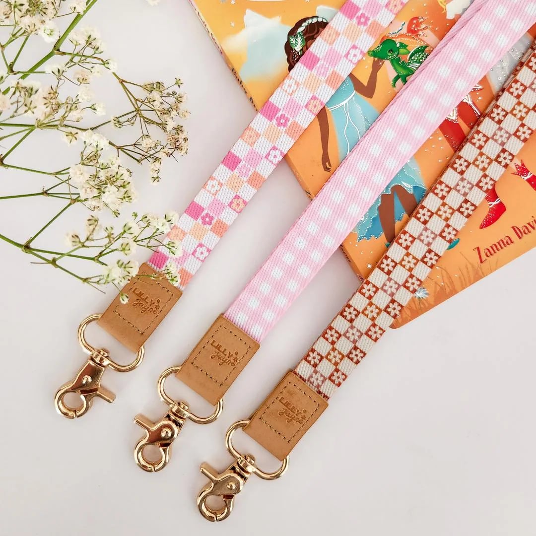Custom lanyard with printed design, featuring a durable strap and metal clip, branded by Pinlord.com for personalized branding.