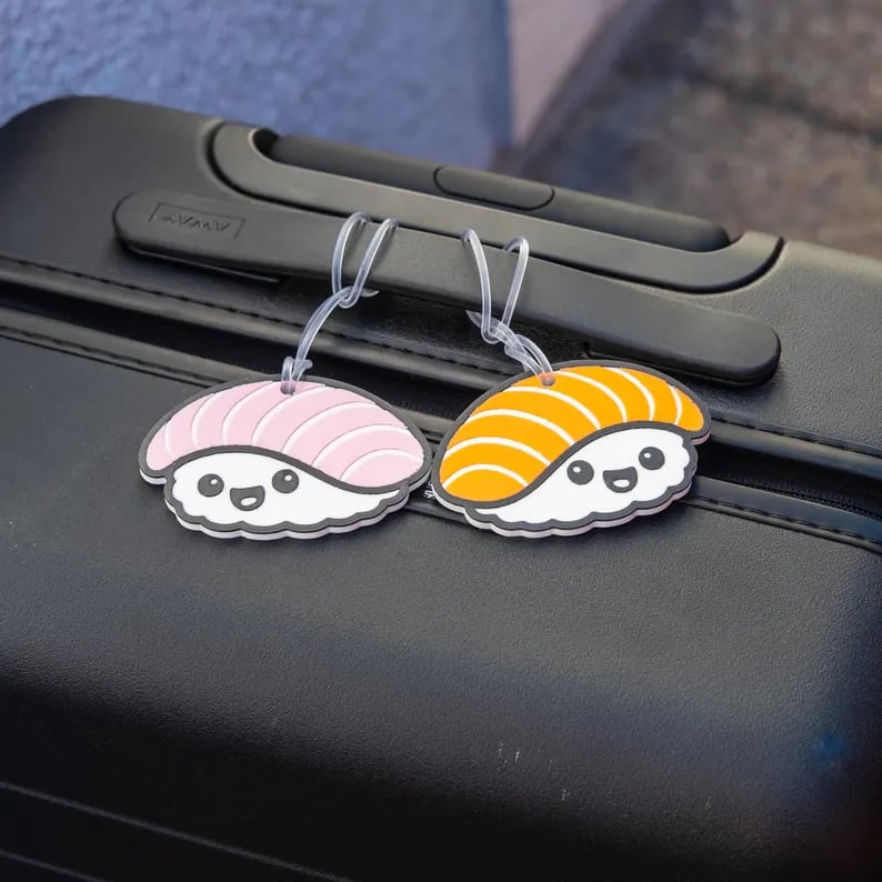 Custom luggage tags from Pinlord.com showing personalized designs on durable, stylish travel accessories.