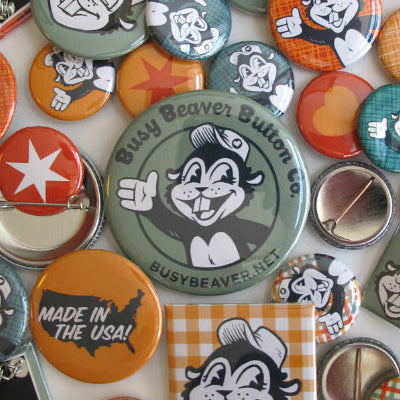 Close-up of a colorful pin badge from Busy Beaver Button Co., showcasing vibrant design and craftsmanship by Pinlord.com.