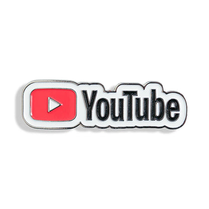 Close-up of custom enamel pins featuring unique designs, displayed on a white background, from Pinlord.com manufacturer.