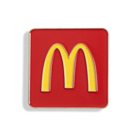 Close-up of custom enamel pins with detailed designs, showcasing the quality and craftsmanship of Pinlord.com manufacturer.