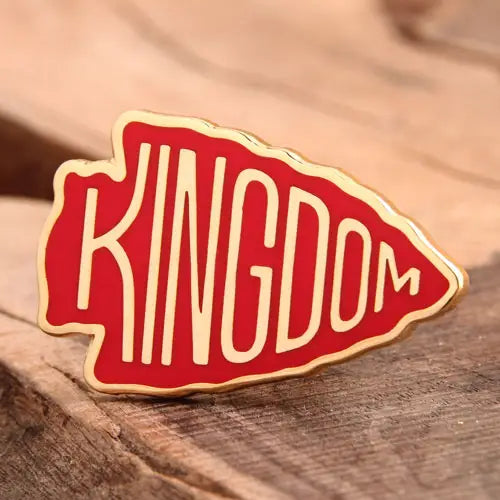 Close-up of colorful arrow-shaped enamel pin from Pinlord.com, showcasing vibrant design and shiny enamel finish.