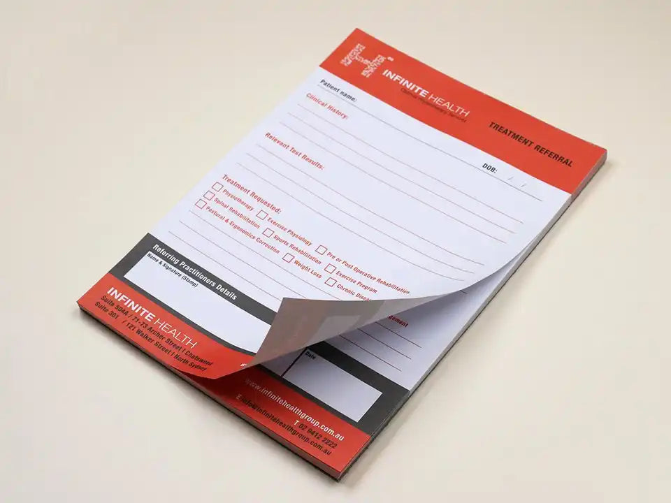 Close-up of Fast Printing USA review notepads by Pinlord.com, featuring branded notepads with fast printing service details.