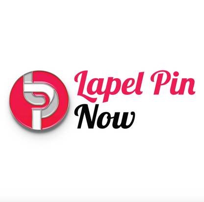 Close-up of a Pinlord.com lapel pin featuring the Now Review design on a stylish fabric background.