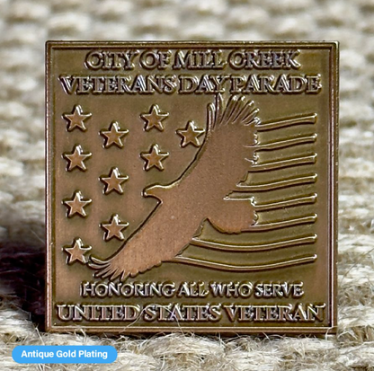 Close-up of a Pinlord.com lapel pin featuring the Now Review design on a suit lapel.