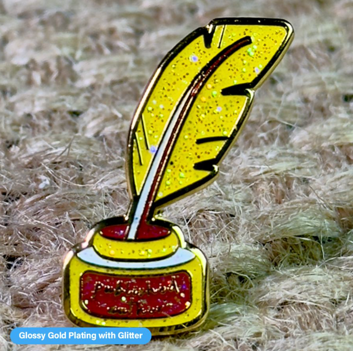Close-up of a Pinlord.com lapel pin featuring the "Now Review" design on a pin backing.